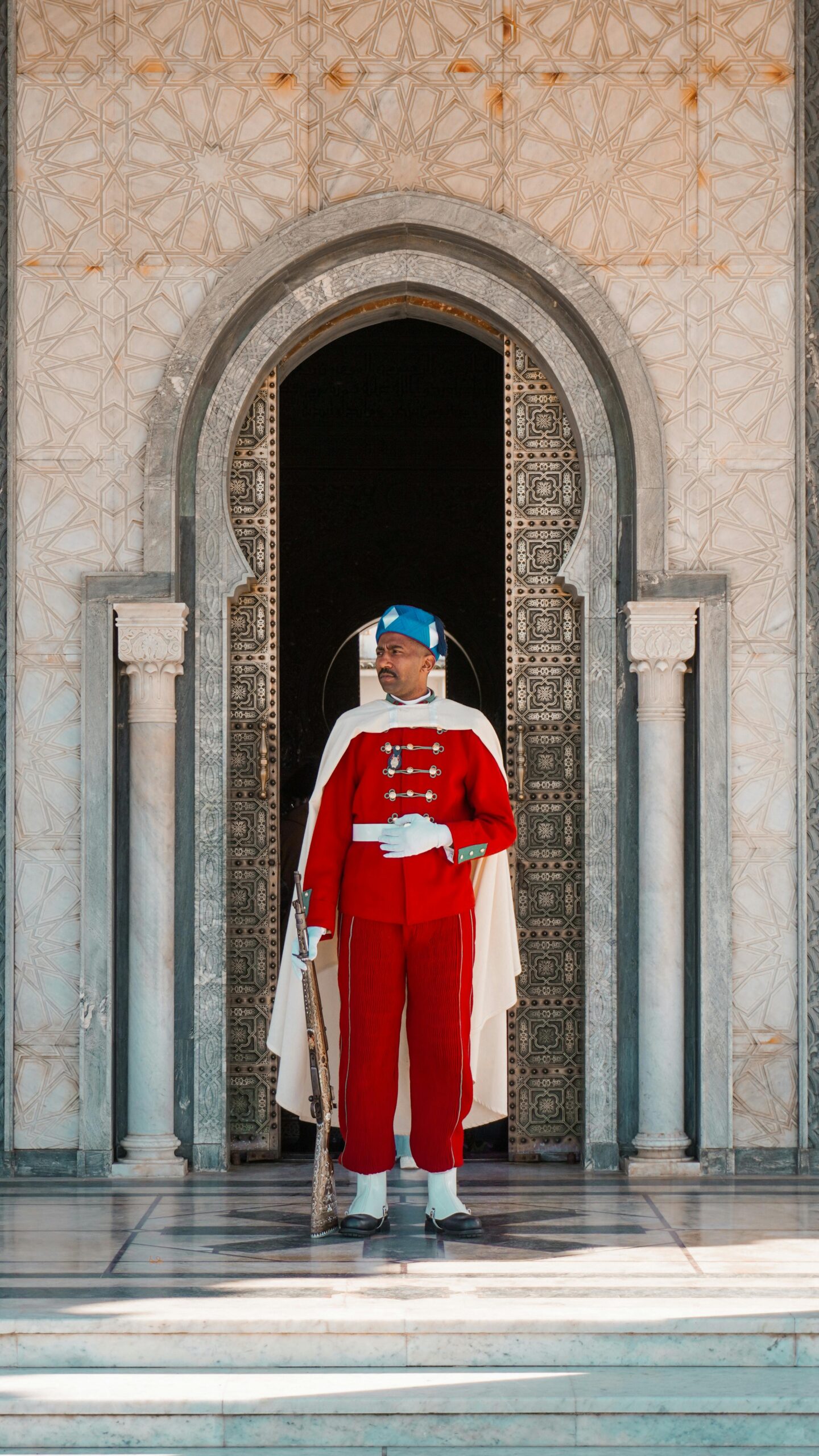 Traditional royal guard standing at the Mausoleum of Mohammed V in Rabat, Morocco.